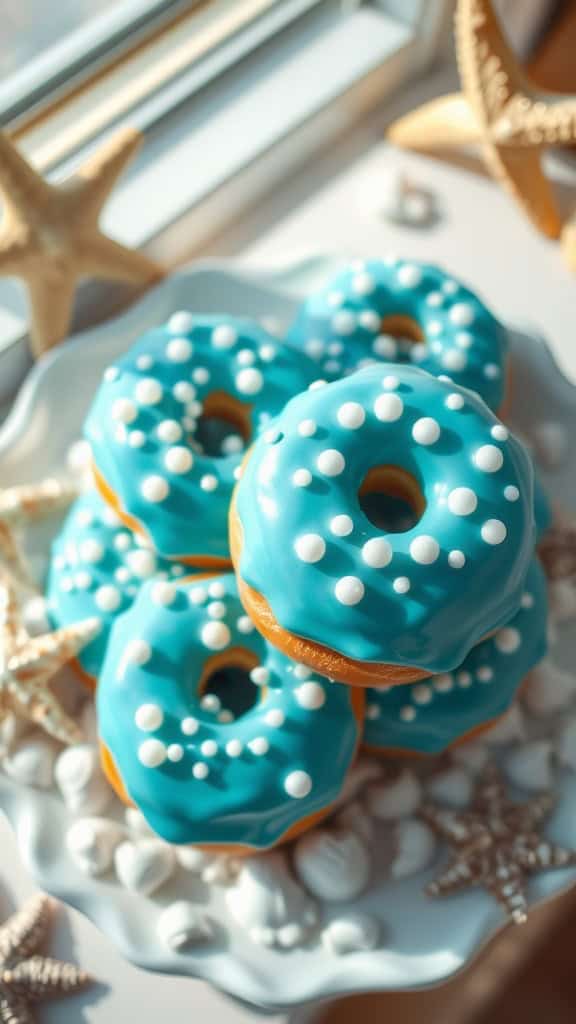 Delicious blue glazed donuts with pearl sprinkles, perfect for a mermaid-themed party.